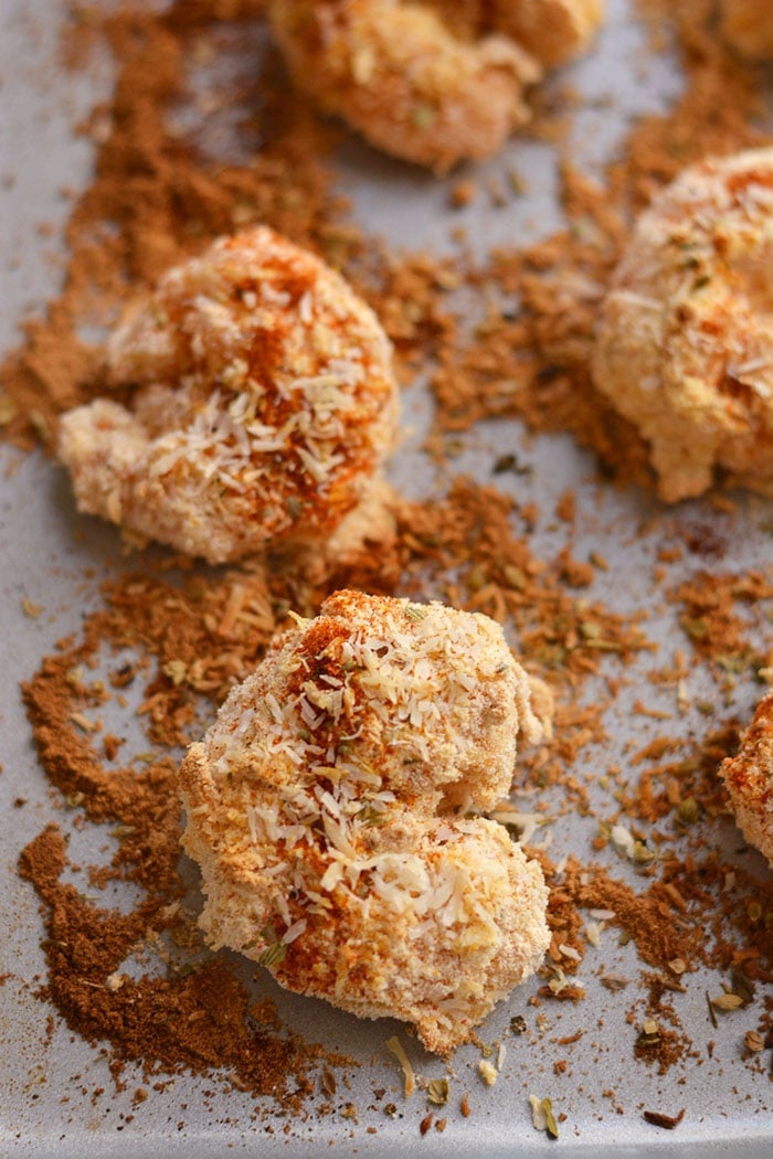 One Pan Baked Coconut Shrimp! Crispy, crunchy, spicy shrimp baked to perfection on a sheet pan. A "breaded" shrimp recipe that's healthy and grain free. Gluten Free + Low Calorie + Paleo