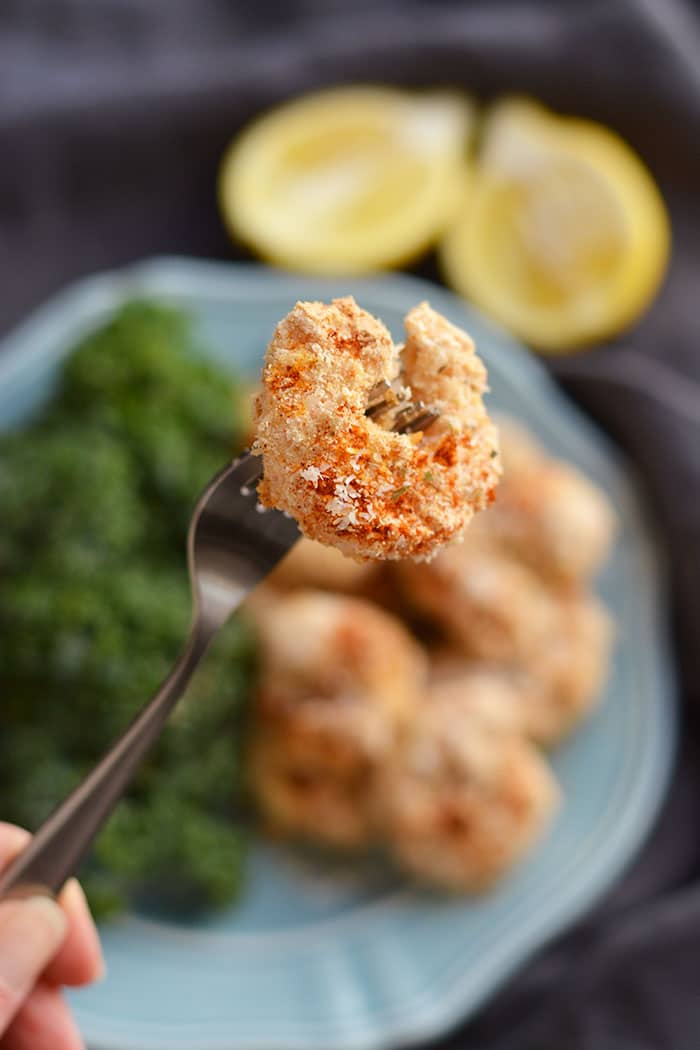 One Pan Baked Coconut Shrimp! Crispy, crunchy, spicy shrimp baked to perfection on a sheet pan. A "breaded" shrimp recipe that's healthy and grain free. Gluten Free + Low Calorie + Paleo