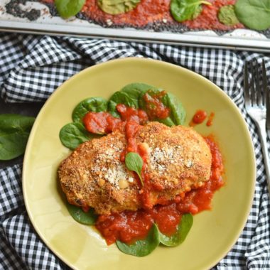 Crispy, cheesy Sheet Pan Chicken Parmesan baked to perfection with a kick of spice & juicy marinara sauce. A healthy alternative to deep frying that will win over any hungry heart. Gluten Free + Low Calorie Weight Loss Friendly Recipe