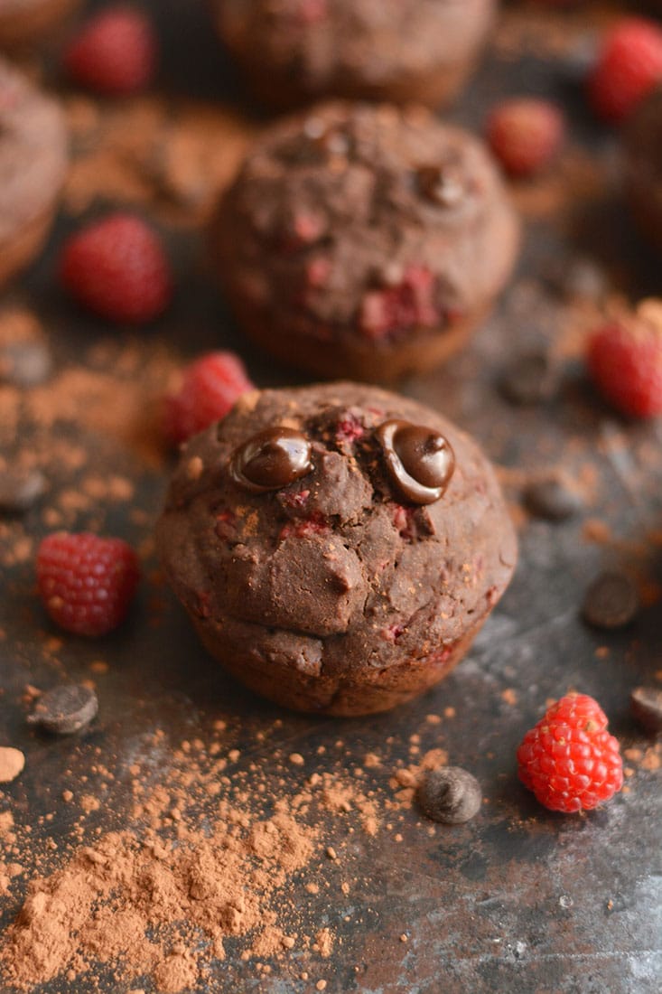 Dark Chocolate Raspberry Muffins bursting with a creamy berry center surrounded by irresistible dark chocolate! A healthier cupcake-like treat that's weight loss friendly. Gluten Free + Low Calorie + Paleo
