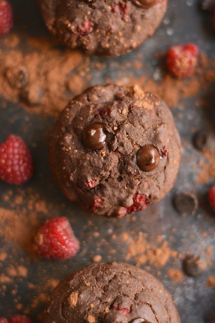 Dark Chocolate Raspberry Muffins bursting with a creamy berry center surrounded by irresistible dark chocolate! A healthier cupcake-like treat that's weight loss friendly. Gluten Free + Low Calorie + Paleo