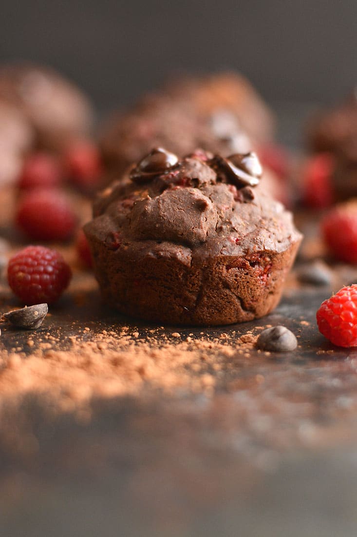 Dark Chocolate Raspberry Muffins bursting with a creamy berry center surrounded by irresistible dark chocolate! A healthier cupcake-like treat that's weight loss friendly. Gluten Free + Low Calorie + Paleo