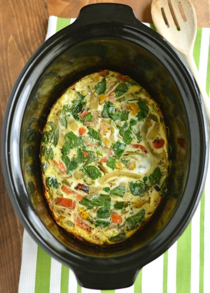 Crockpot Veggie Omelet! Make breakfast easy by letting the slow cooker do the work! This simple make ahead breakfast is loaded with vegetable & protein. The perfect way to start the day. Paleo + Gluten Free + Low Calorie!