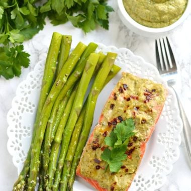 20 Minute Baked Pesto Salmon. Steamed in foil packs, this Paleo, low calorie, gluten free meal is a healthy twist on a dinner favorite! Gluten Free + Low Calorie + Paleo