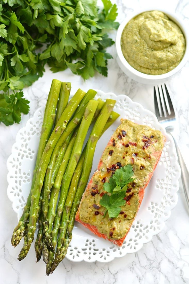 20 Minute Baked Pesto Salmon. Steamed in foil packs, this Paleo, low calorie, gluten free meal is a healthy twist on a dinner favorite! Gluten Free + Low Calorie + Paleo