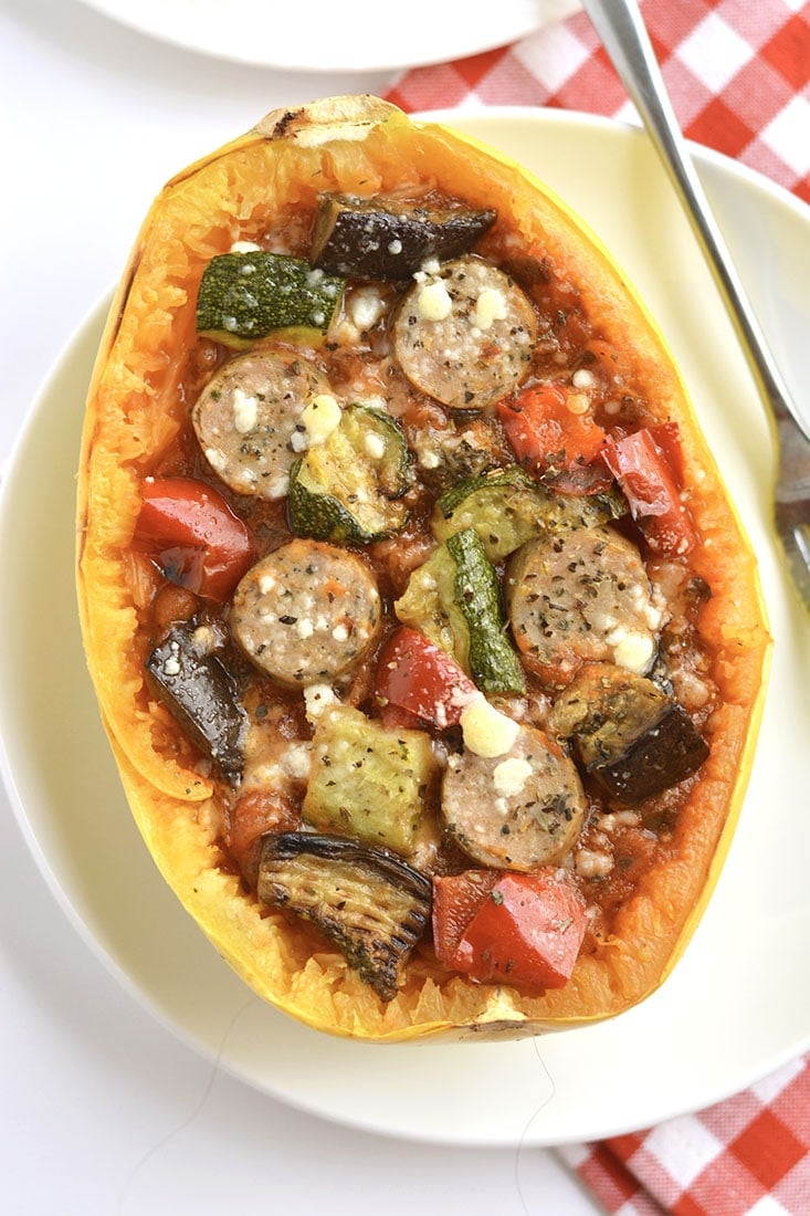 Spaghetti Squash Pizza! Customize with your favorite pizza toppings for an easy to make meal that's low carb, filling & delicious! Gluten Free + Low Calorie
