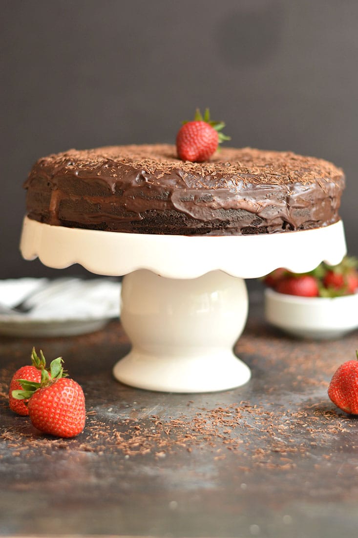 This Paleo Healthy Chocolate Cake is a healthier version of cake and easy to make with almond flour, maple syrup, cocoa, coconut cream & chocolate. The chocolate ganache center is truly irresistible. Guaranteed to be loved by the entire family! Gluten Free + Low Calorie + Paleo