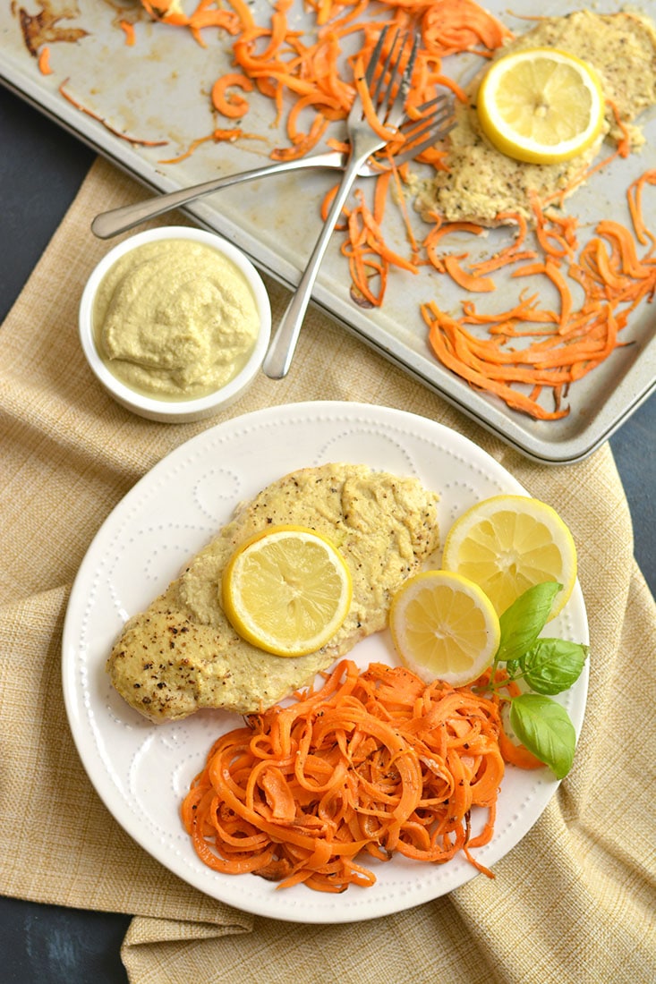 Sheet Pan Hummus Chicken marinated in Paleo zucchini hummus turns boring chicken into a flavorful meal. Paired with spiralized sweet potato for a french fry like side. All made on one sheet pan in 20 minutes! Paleo + Gluten Free + Low Calorie