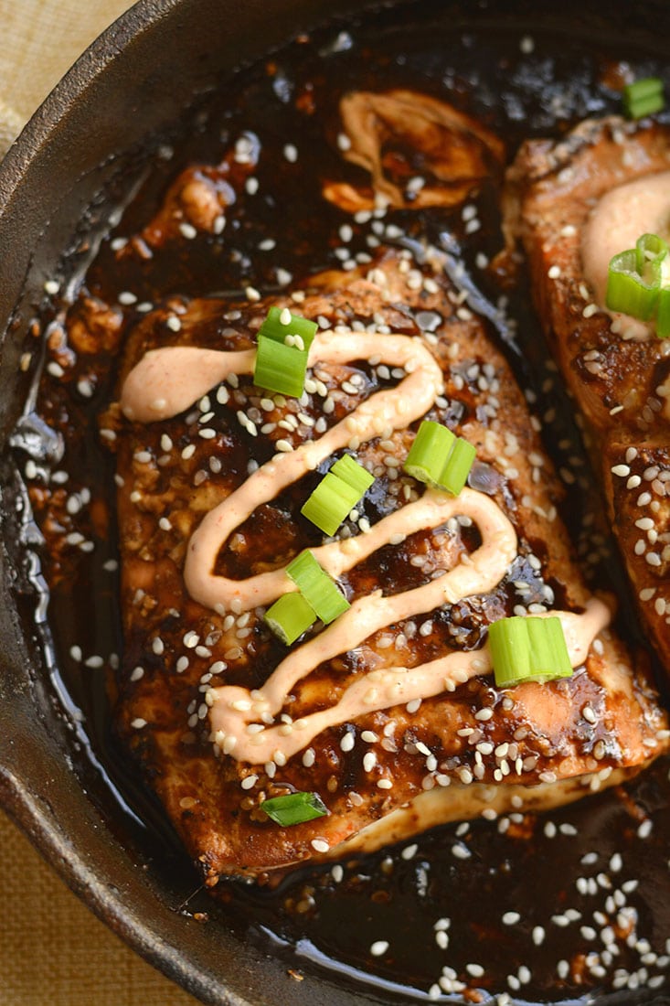 An easy skillet Teriyaki Sriracha Salmon marinated in a homemade teriyaki sauce & topped with a Sriracha Greek yogurt sauce that you can't resist! Big on flavor, spicy as you like & perfect for a quick meal. Gluten Free + Low Calorie
