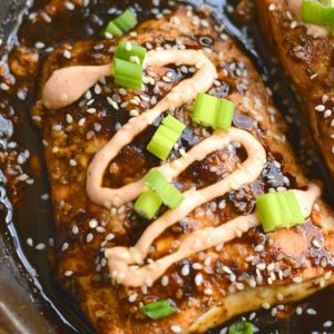 An easy skillet Teriyaki Sriracha Salmon marinated in a homemade teriyaki sauce & topped with a Sriracha Greek yogurt sauce that you can't resist! Big on flavor, spicy as you like & perfect for a quick meal. Gluten Free + Low Calorie