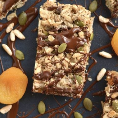 These homemade Trail Mix Granola Bars are easy to make with apricots, gluten free oats, brown rice cereal, pumpkin seeds & chocolate. A sweet, salty, chewy bar that's naturally sweetened. A wholesome recipe for a nutritious snack or breakfast to go! Gluten Free + Low Calorie + Vegan