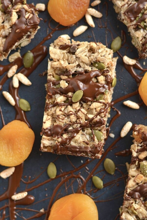 These homemade Trail Mix Granola Bars are easy to make with apricots, gluten free oats, brown rice cereal, pumpkin seeds & chocolate. A sweet, salty, chewy bar that's naturally sweetened. A wholesome recipe for a nutritious snack or breakfast to go! Gluten Free + Low Calorie + Vegan