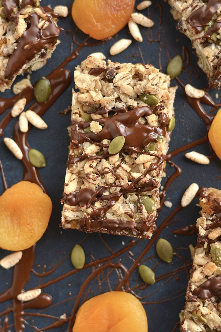 These homemade Trail Mix Granola Bars are easy to make with apricots, gluten free oats, brown rice cereal, pumpkin seeds & chocolate. A sweet, salty, chewy bar that's naturally sweetened. A wholesome recipe for a nutritious snack or breakfast to go! Gluten Free + Low Calorie + Vegan