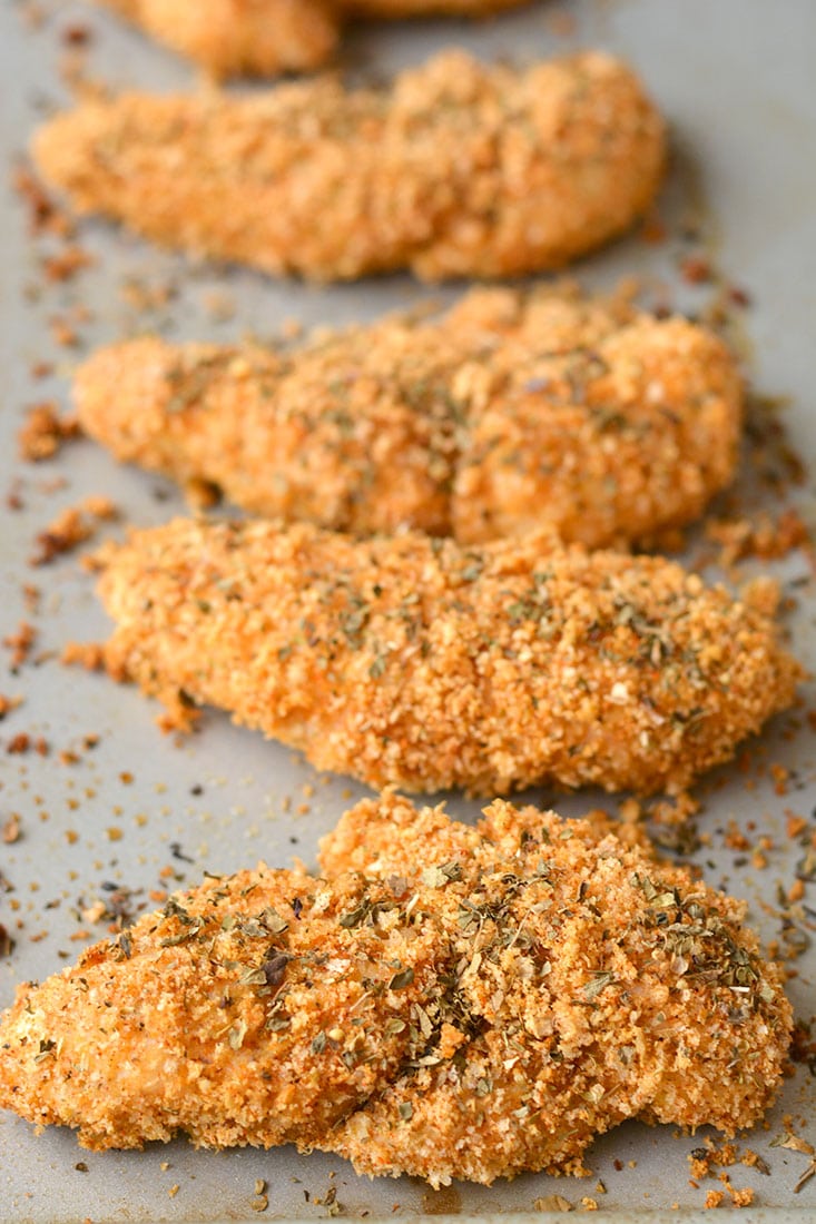 These Healthy Chicken Fingers have the same crunch of fried chicken for a fraction of the calories! Made with 4 ingredients, this Gluten Free meal is one you can feel good about eating! Gluten Free + Low Calorie