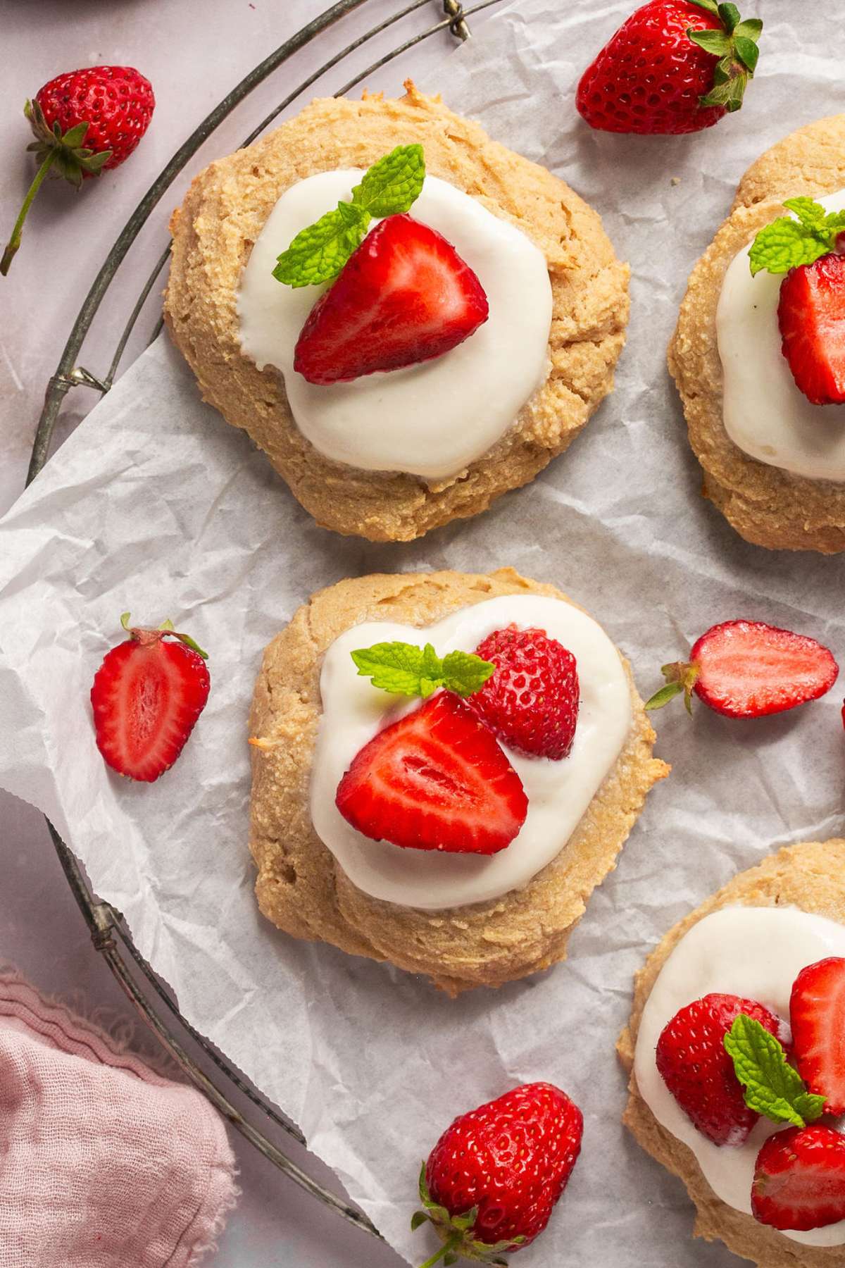 Sugar-free strawberry shortcake topped with creamy yogurt, fresh strawberries, and sprigs of mint.