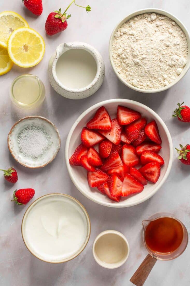 Ingredients to make healthy strawberry shortcake on the taable.