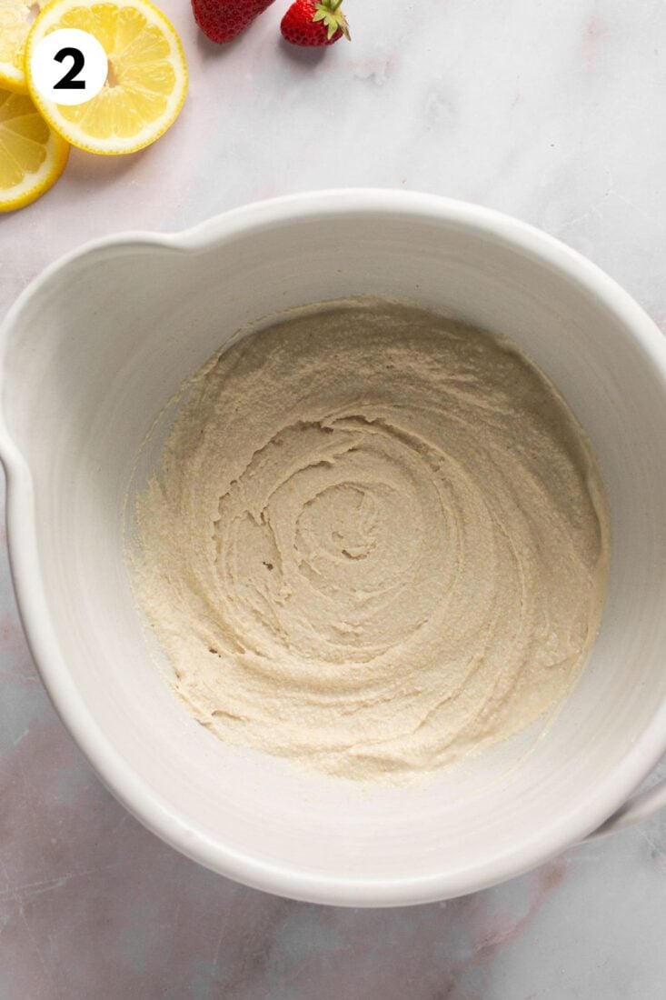 Biscuit dough is mixed until smooth in a bowl.