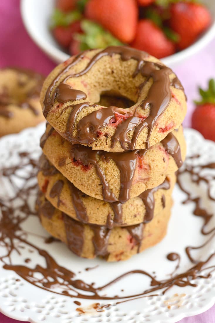 Skinny Strawberry Chocolate Donuts baked in the oven with lighter, healthier ingredients. Great for a sweet breakfast or snack, and super easy to make. Gluten Free + Low Calorie