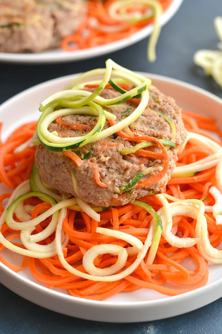 Spiralized Turkey Burgers with Zucchini & Carrots! These burgers make a bold statement with curly strands of veggies. With 4 ingredients & 10 minutes to make, this veggie packed recipe is one anyone can make. Paleo + Gluten Free + Low Calorie