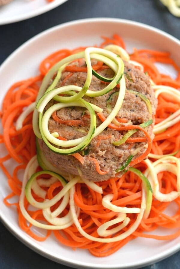 Spiralized Turkey Burgers with Zucchini & Carrots! These burgers make a bold statement with curly strands of veggies. With 4 ingredients & 10 minutes to make, this veggie packed recipe is one anyone can make. Paleo + Gluten Free + Low CalorieSpiralized Turkey Burgers with Zucchini & Carrots! These burgers make a bold statement with curly strands of veggies. With 4 ingredients & 10 minutes to make, this veggie packed recipe is one anyone can make. Paleo + Gluten Free + Low Calorie