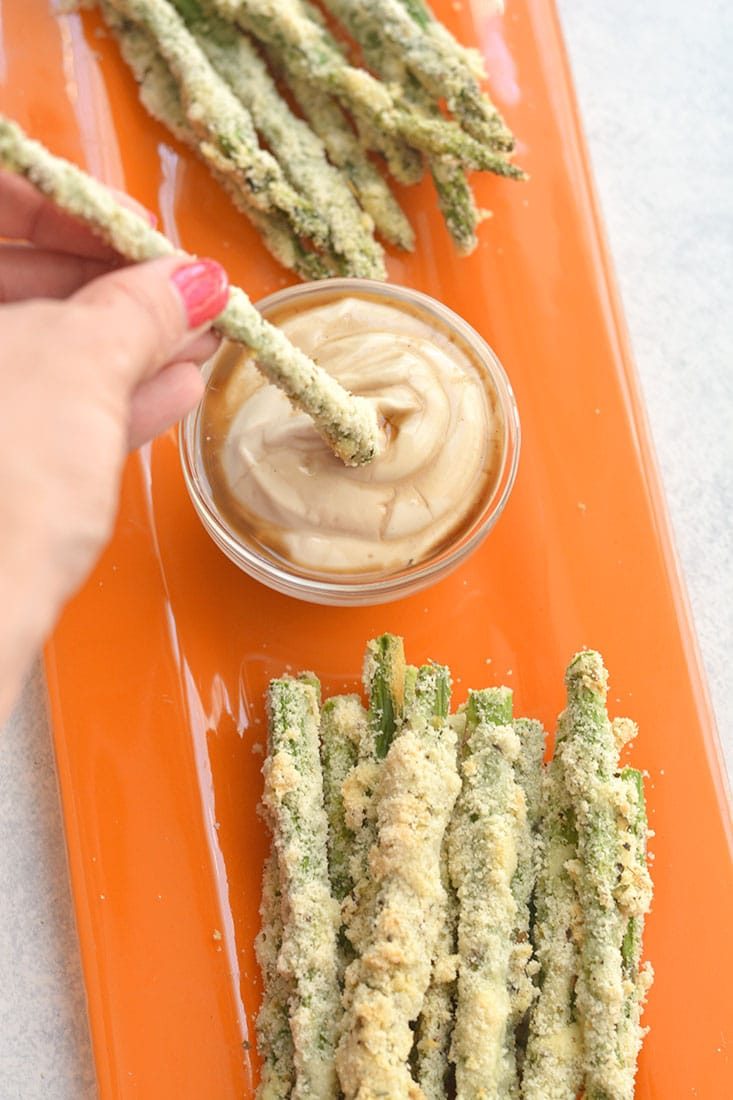Eat more veggies! This Almond Crusted Asparagus with Soy Yogurt recipe is an easy way of flavoring boring veggies so you'll want to eat more of them. Paired with a simple Greek yogurt dipping sauce to dip your asparagus fries into for a simple & tasty side or appetizer. Gluten Free + Low Calorie