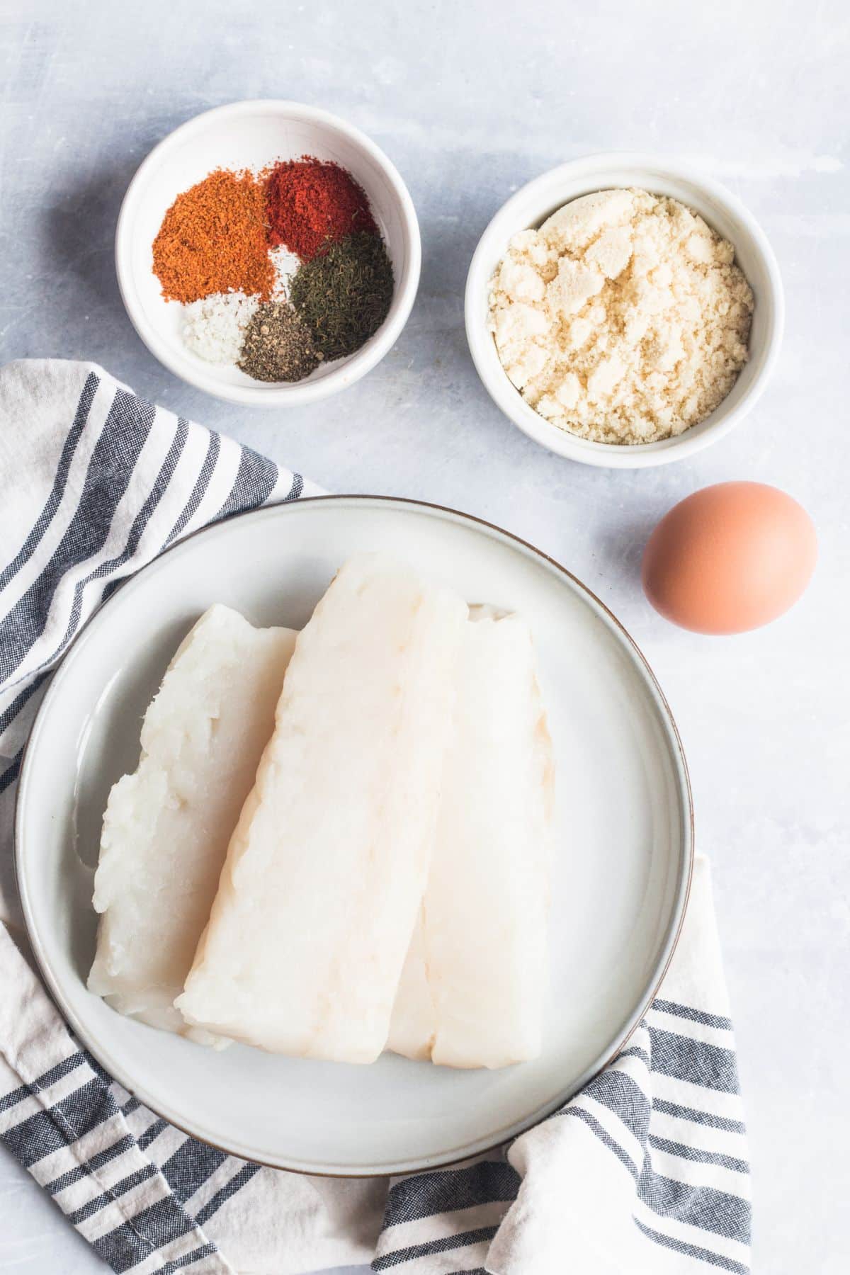 Ingredients to make fish sandwiches on the table before preparing.