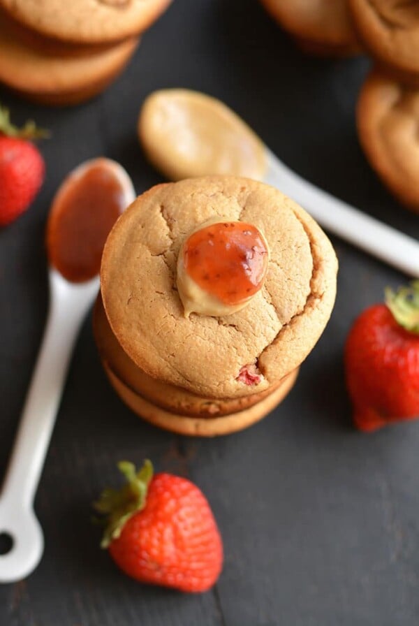 Healthy Peanut Butter & Jelly Muffins! These almond flour PB&J muffins are creamy, protein-packed & lightly sweetened with fresh strawberries. Take one with you for a healthy snack on the go! Gluten Free + Low Calorie