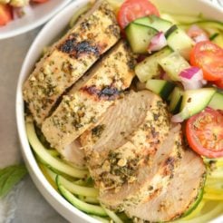 This Greek Chicken with Zucchini Noodles makes a perfect no fail meal! A zippy & fresh Greek salad tossed in zucchini noodles with marinated Greek chicken. Light, fresh & filling! Paleo + Low Carb + Gluten Free + Low Calorie
