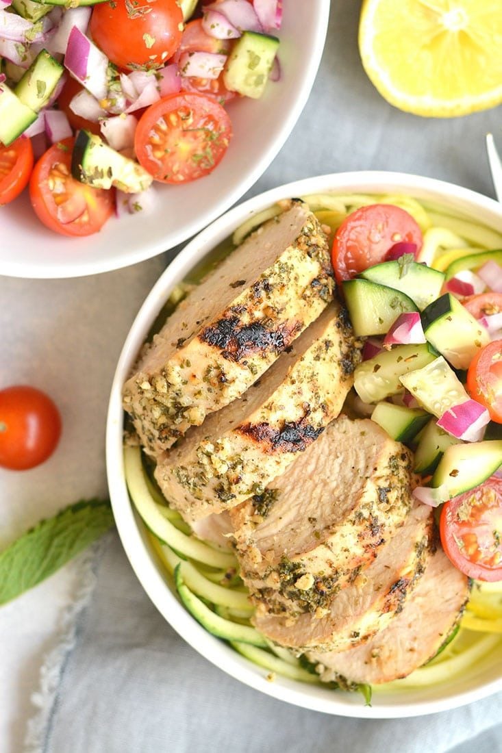 This Greek Chicken with Zucchini Noodles makes a perfect no fail meal! A zippy & fresh Greek salad tossed in zucchini noodles with marinated Greek chicken. Light, fresh & filling! Paleo + Low Carb + Gluten Free + Low Calorie