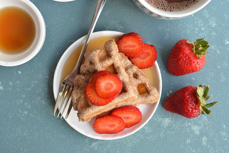 Super Easy 5 Ingredient Coconut Flour Waffles! Made with real food ingredients, these low carb waffles are the perfect fuel for a busy morning or weekend breakfast. Freezer friendly for meal prep too! Paleo + Low Calorie + Gluten Free