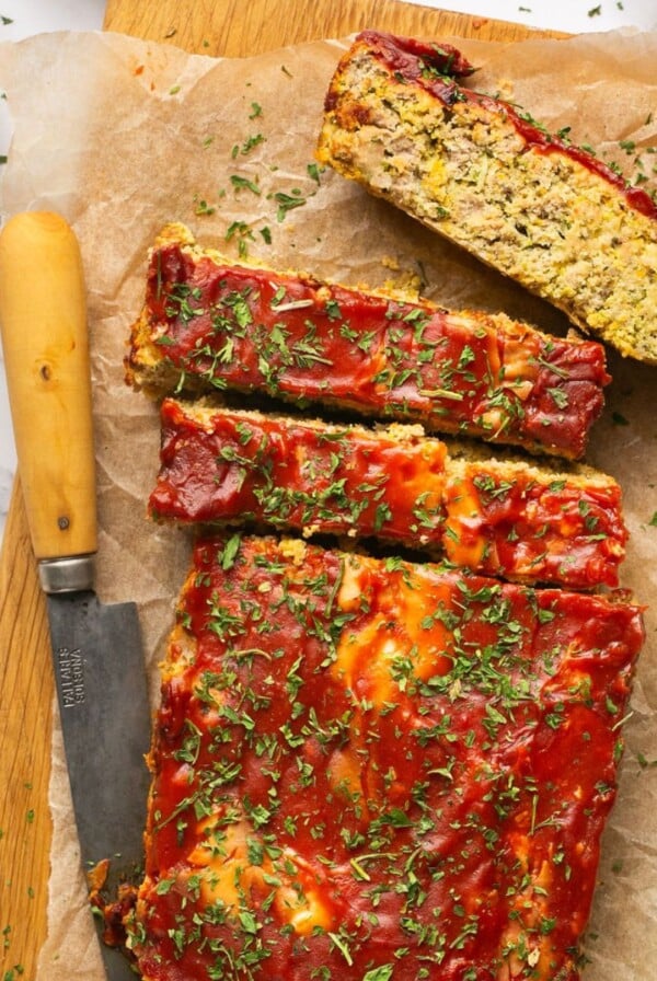 Savory Paleo Carrot Zucchini Meatloaf! A classic recipe gets a healthy makeover as a leaner, low carb, protein-packed meal. Bonus, all veggies included! Great for meal prepping for lunch or dinner! Gluten Free + Low Calorie + Paleo