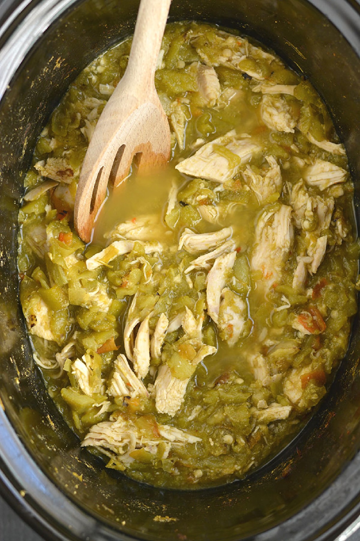 shredded chicken with hatch green chile in a slow cooker.