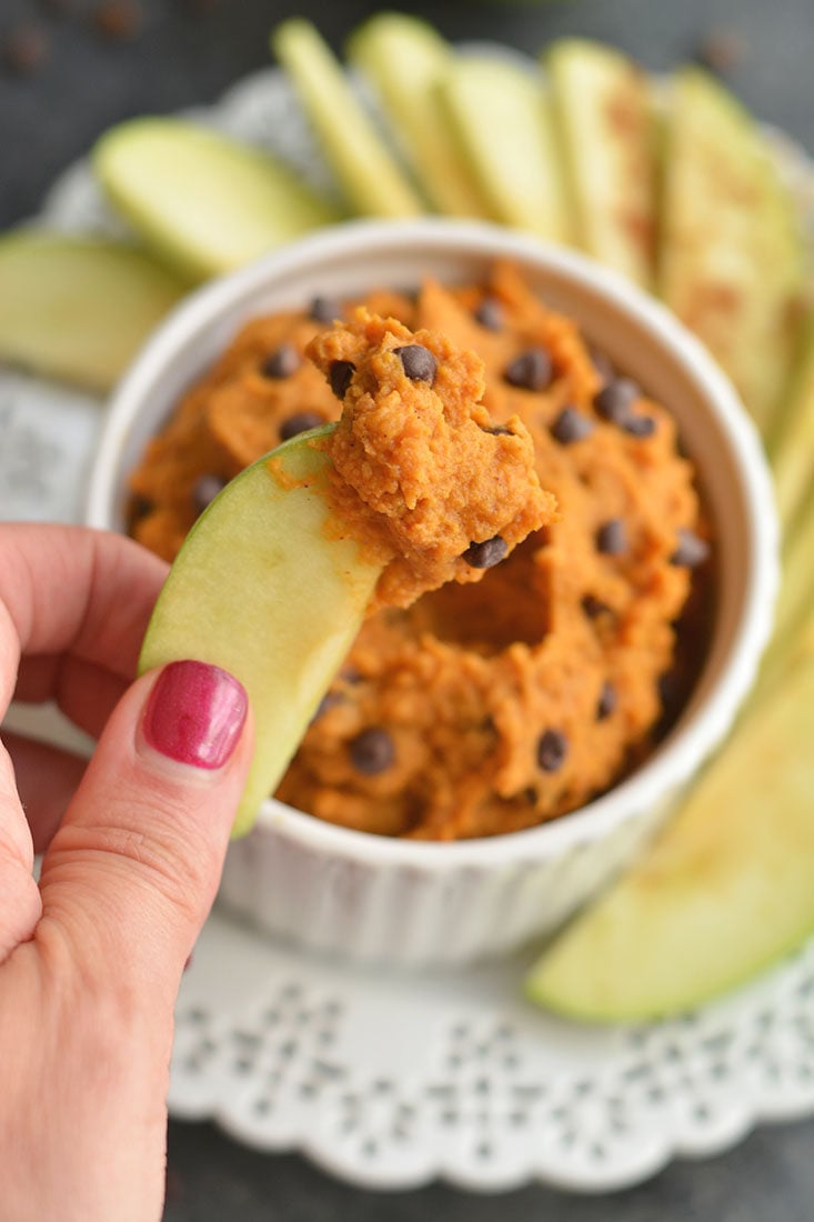 Pumpkin Protein Cookie Dough! A high protein dip for dipping fruit in or eating by the spoonful. EASY to make & tastes like cookie dough. Gluten Free + Vegan + Low Calorie + Paleo