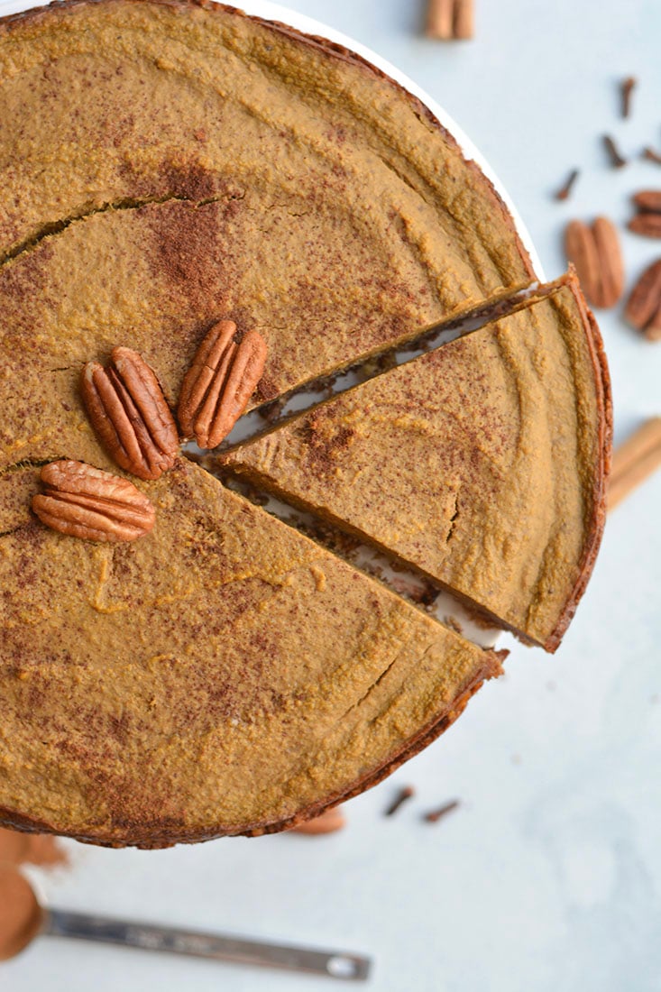 Skinny Pumpkin Pie! Made with a pecan oat crust and topped with a lightly sweetened pumpkin custard. This pumpkin pie is incredibly easy to make, flavorful and perfect for getting a pumpkin fix. Gluten Free + Low Calorie