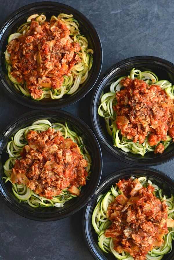 Meal Prep Bolognese with Zucchini Noodles! Healthy bolognese made with zucchini noodles & artichokes in 15 minutes. A classic recipe made over with simple ingredient swaps. EASY for meal prepping a healthy lunch or dinner. Gluten Free + Low Calorie + Paleo