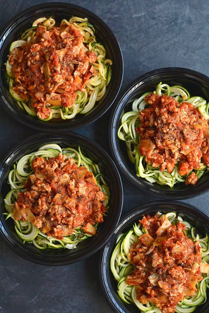 Meal Prep Bolognese with Zucchini Noodles! Healthy bolognese made with zucchini noodles & artichokes in 15 minutes. A classic recipe made over with simple ingredient swaps. EASY for meal prepping a healthy lunch or dinner. Gluten Free + Low Calorie + Paleo