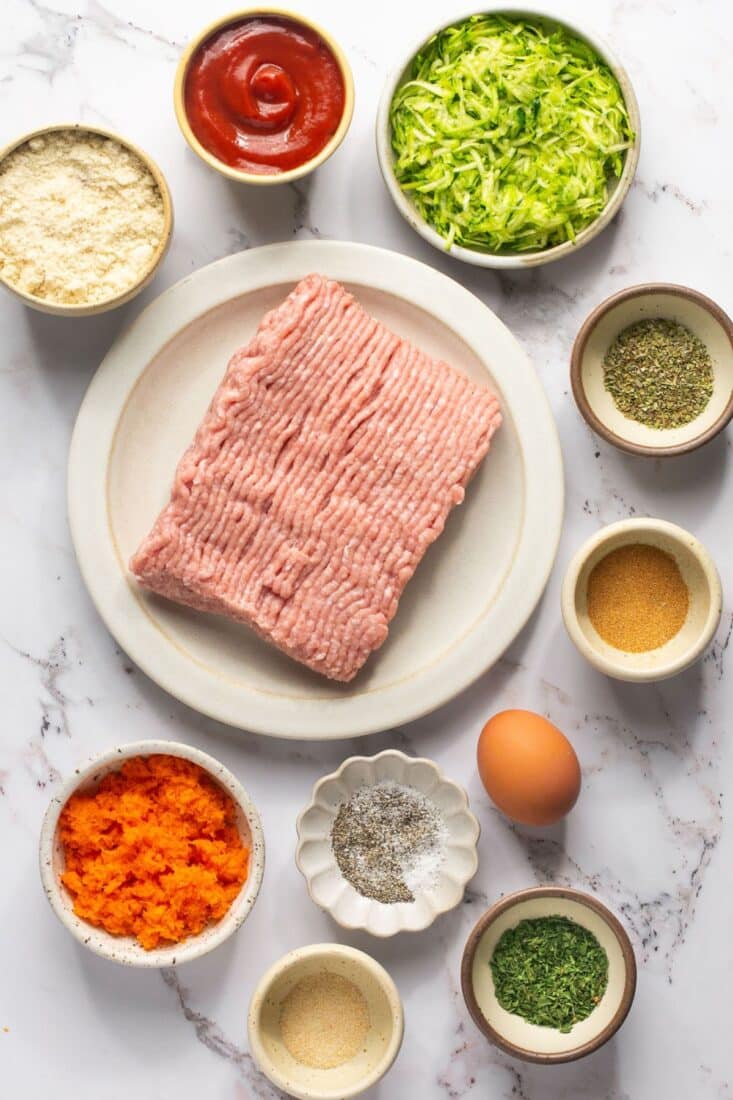 Ingredients to make gluten-free meatloaf on the table before mixing.