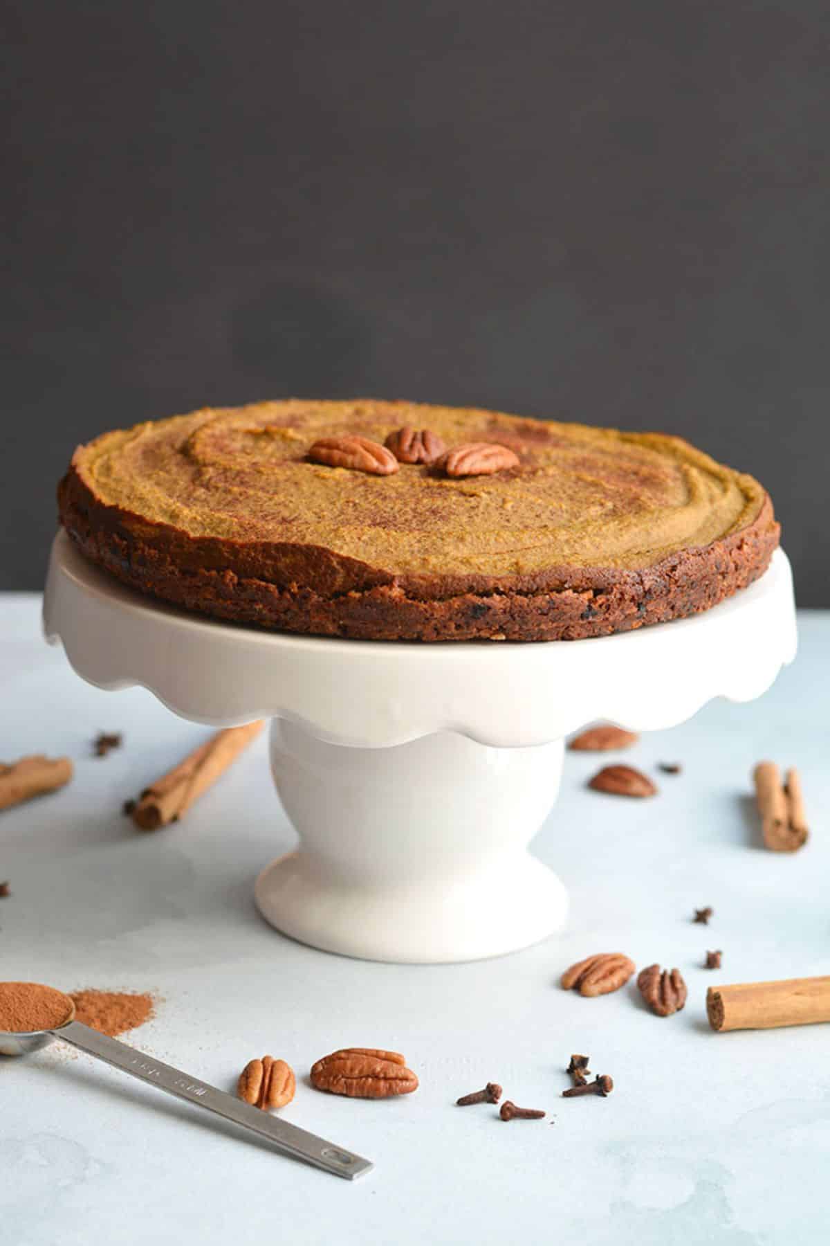 Low calorie pumpkin pie on a serving stand.