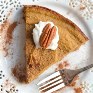 A slice of low calorie pumpkin pie on a plate.