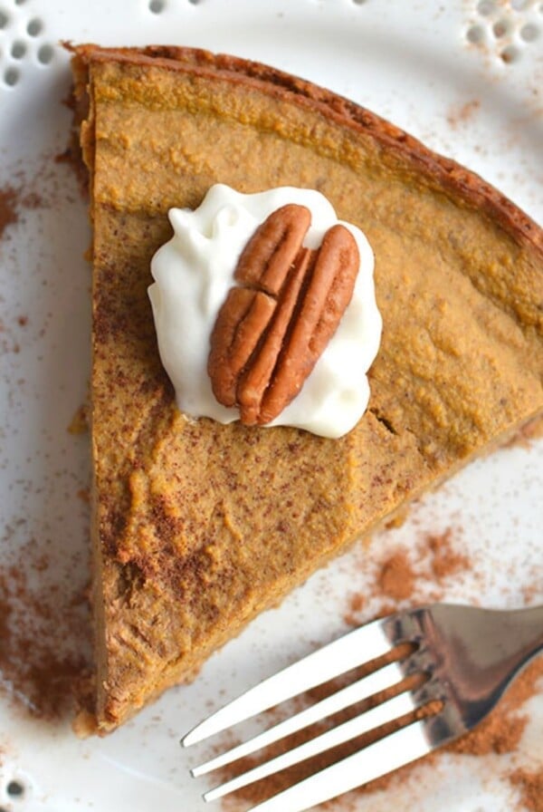 A slice of low calorie pumpkin pie on a plate.