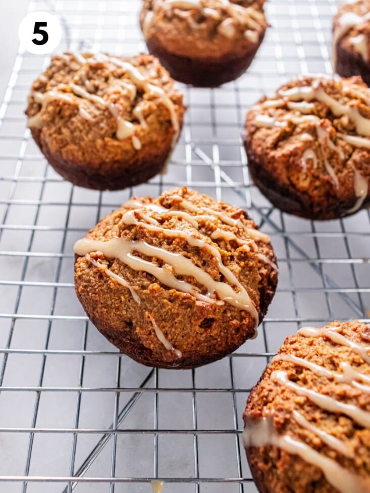 Drizzling the glaze over cooled muffins.