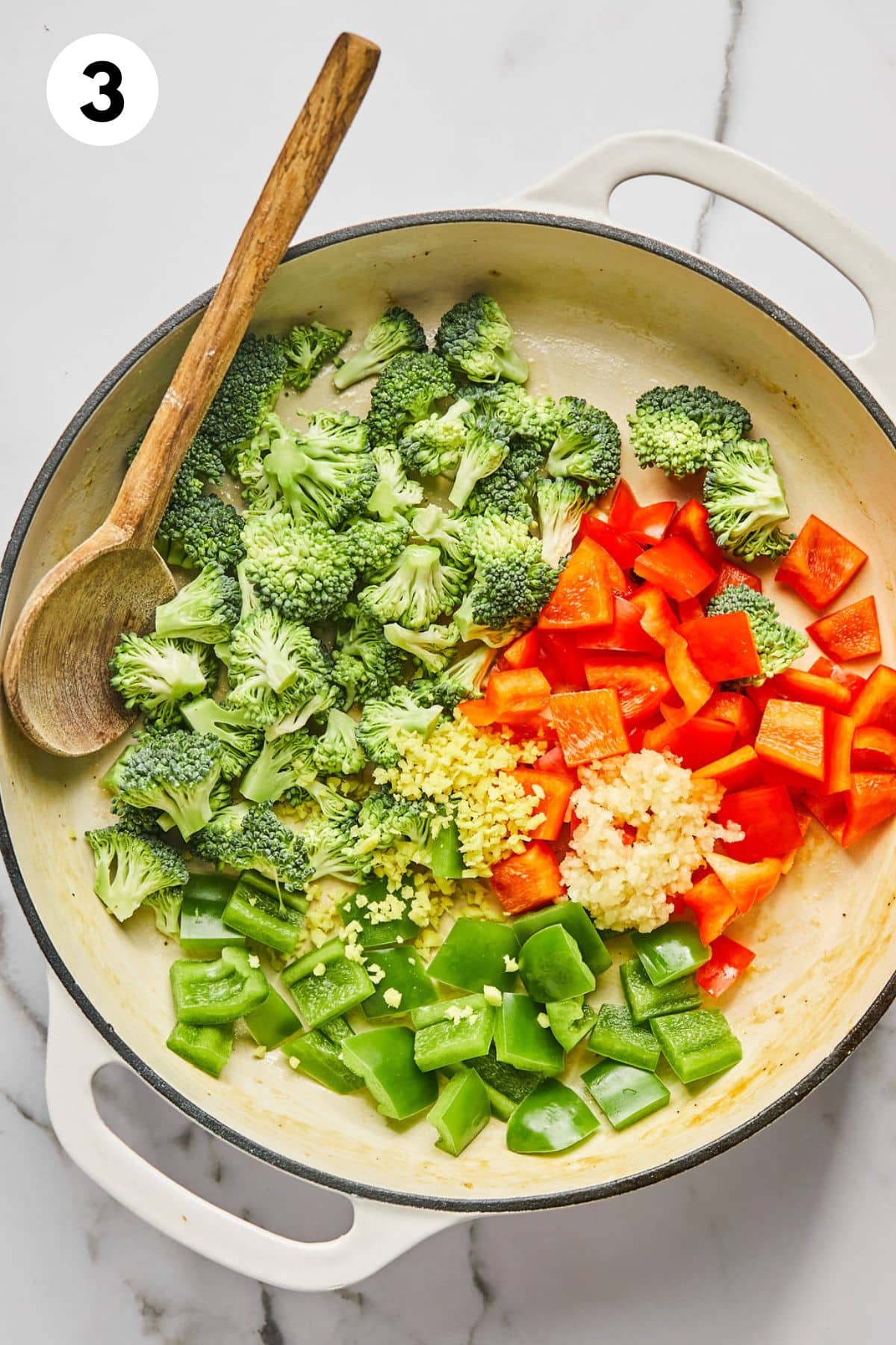 Veggies being cooked in a skillet.