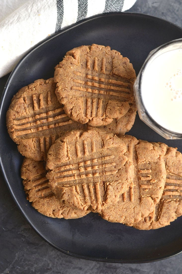 5 Ingredient Low Carb Peanut Butter Cookies! Made with 5 ingredients, these grain, sugar and oil free, these low carb cookies are a healthier version of a childhood favorite! Gluten Free + Low Carb + Low Calorie