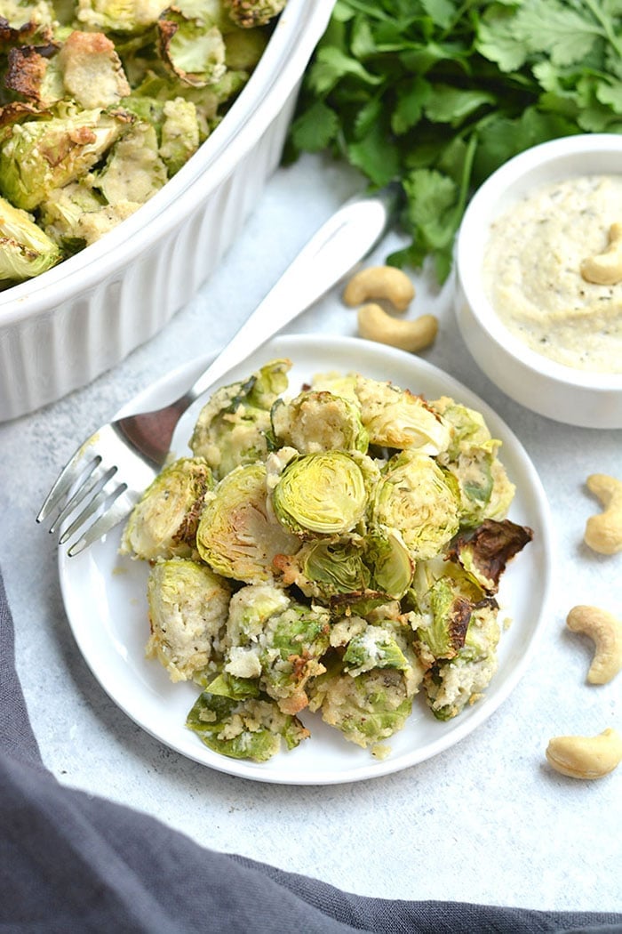 Crispy Brussels Sprouts With Cashew Cream Sauce! Roasted Brussels sprouts tossed in a Vegan creamy cashew sauce. A healthy spin on Brussels sprouts gratin that's dairy-free and delicious. A healthy side dish to add to any meal. Vegan + Paleo + Gluten Free + Low Calorie + Whole30