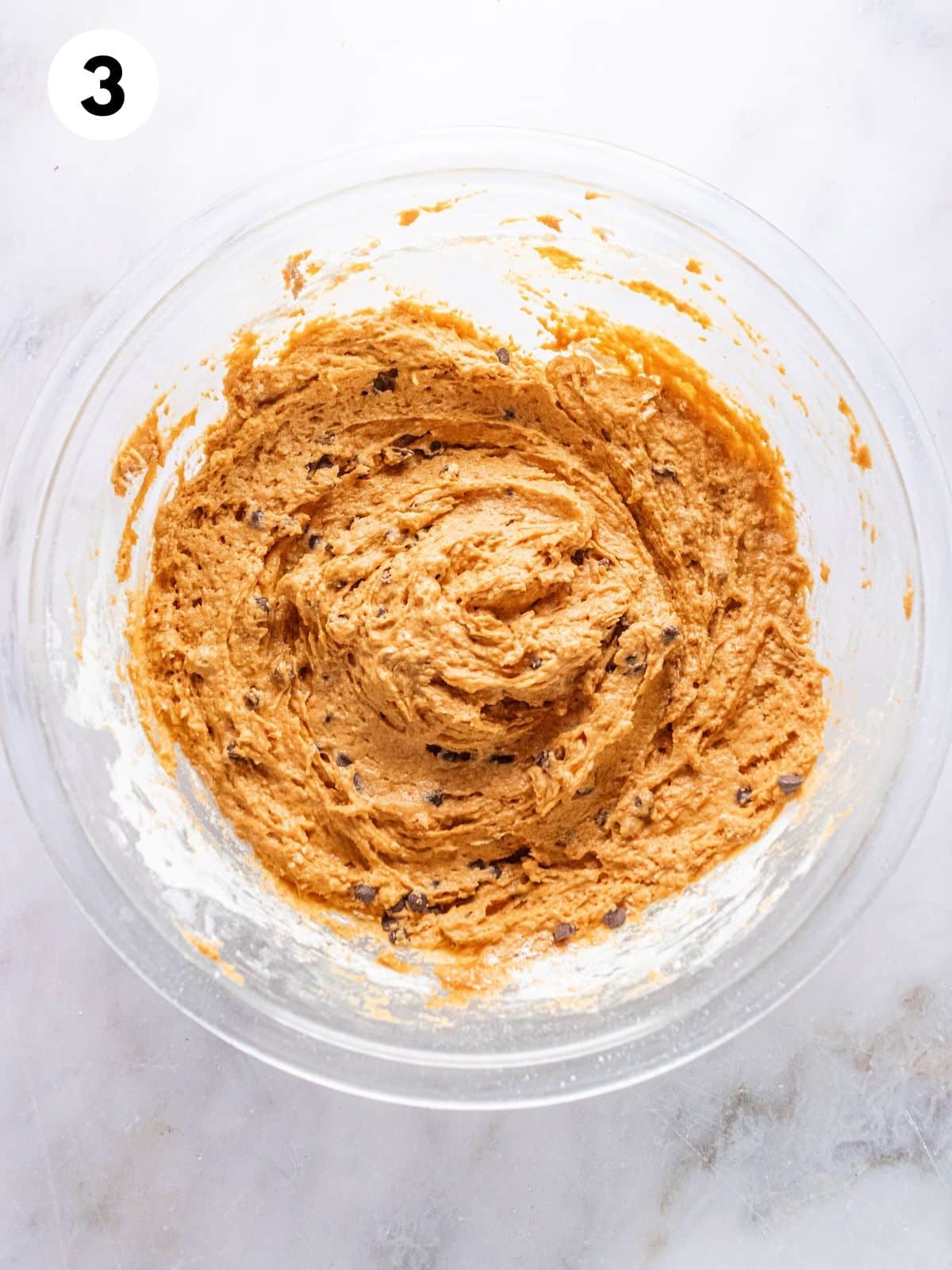 Chocolate gingerbread cake batter in a bowl.