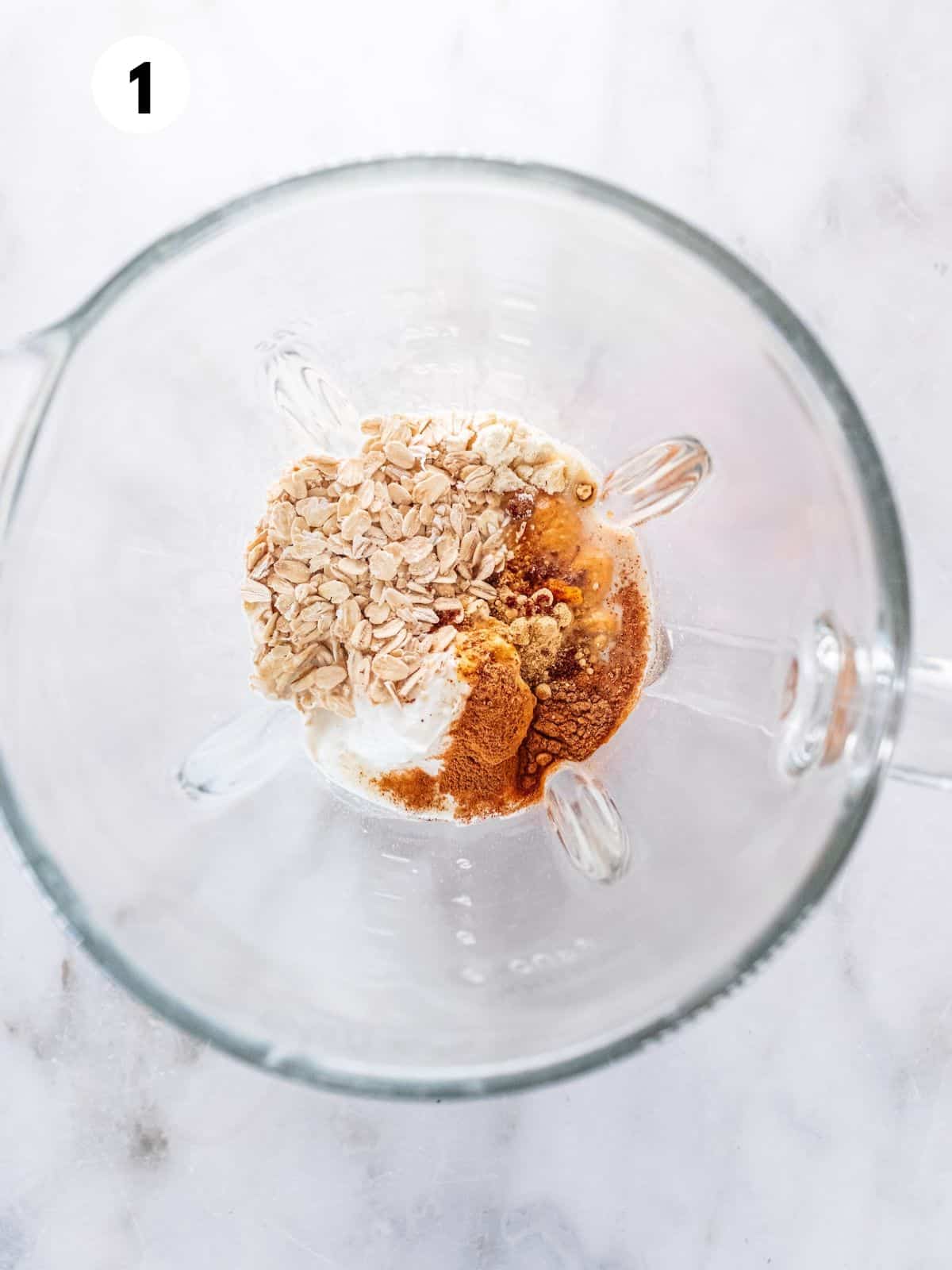 Gingerbread smoothie ingredients added to a blender.