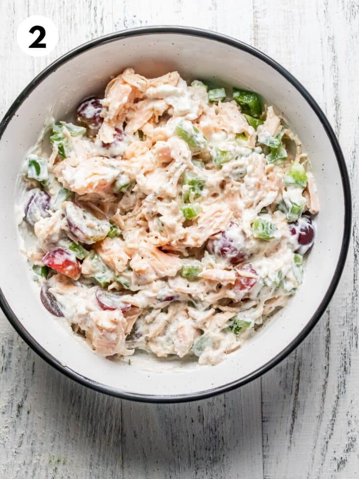Healthy chicken salad mixed together in a bowl.