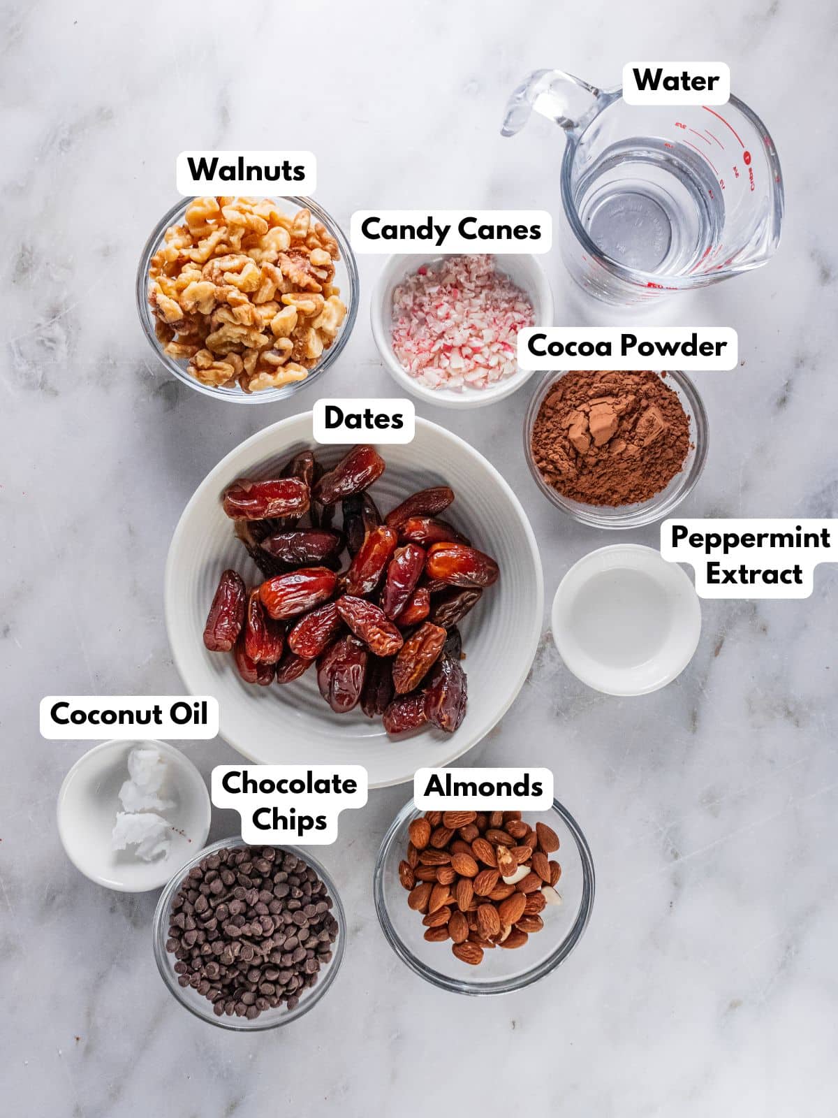 Ingredients to make peppermint brownies in bowls on a countertop.
