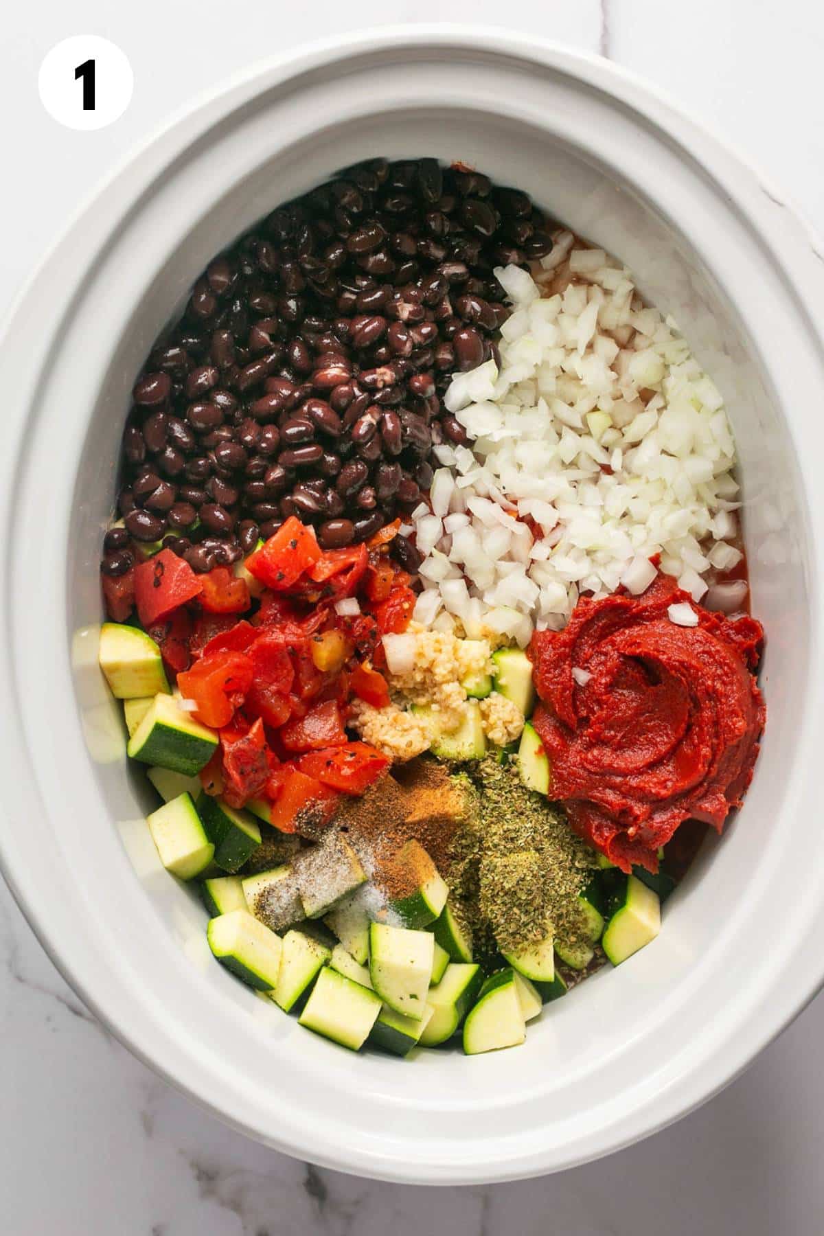 Ingredients in the slow cooker to make black bean chili.