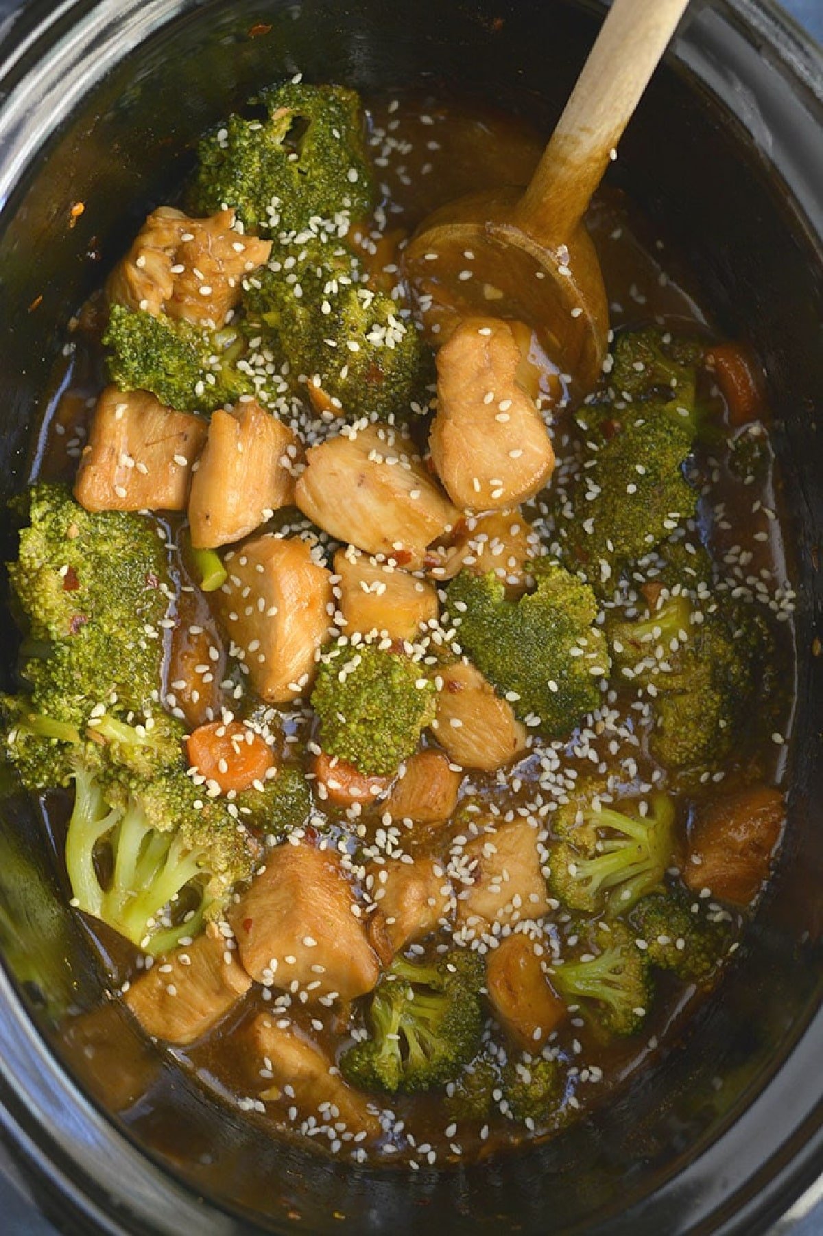 cubed chicken, broccoli, carrots in a slow cooker.